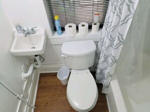 Bathtub, hair dryer, towels
