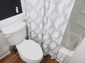 Bathtub, hair dryer, towels
