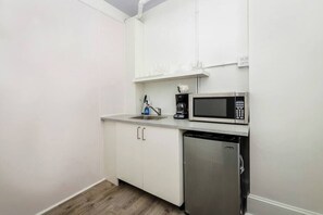 Mini-fridge, microwave, stovetop, coffee/tea maker