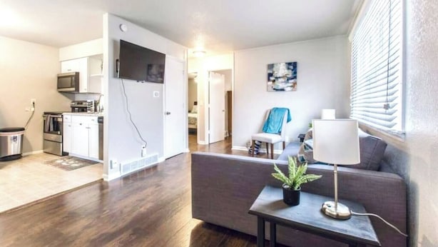 A modern apartment with a kitchen, dining area, and living room. - Great for a staycation, or work-from-home alternative (Kansas City)