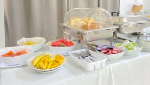 A buffet setup with various food items and utensils. - Hotel El Marques de Manga (Cartagena)
