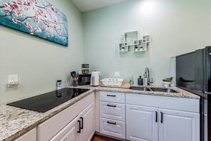 Fridge, microwave, stovetop, coffee/tea maker
