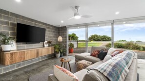 Smart TV, fireplace, books, offices