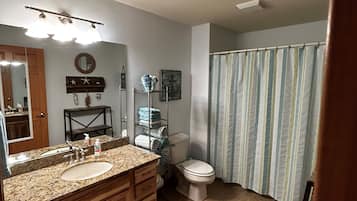 Shower, jetted tub, hair dryer, towels