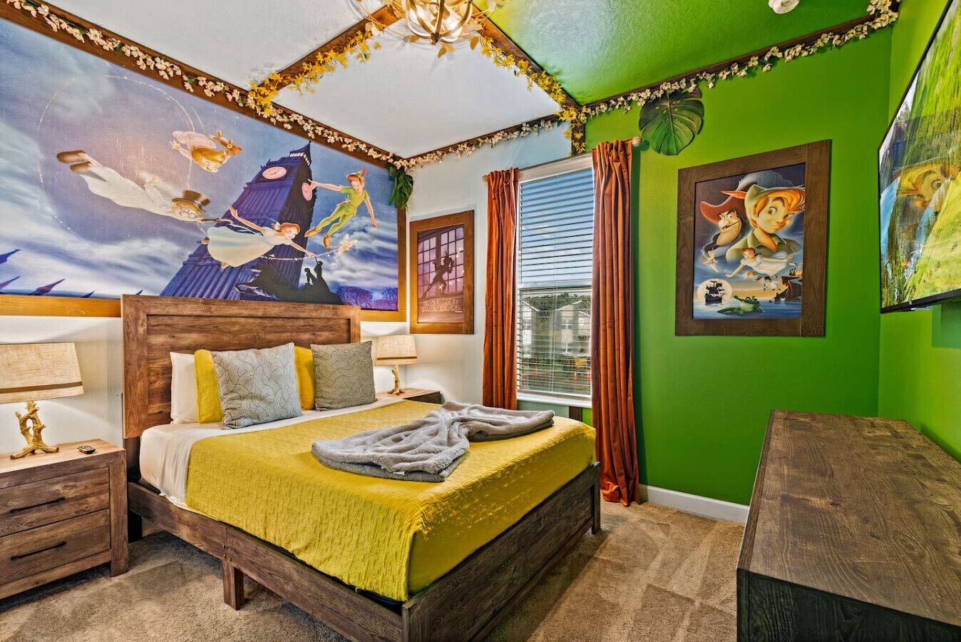 A bedroom with a large bed, a wooden headboard, a nightstand, a lamp, and a painting on the wall.