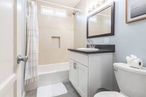 Hair dryer, towels, soap, shampoo