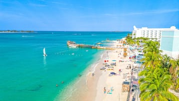 On the beach, sun loungers, beach towels