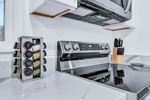 Fridge, microwave, oven, stovetop - The Mid-Century Retreat (Lansing)