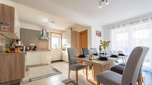 A modern kitchen with a dining area. - Amazing apartment in Gracac (Gracac)