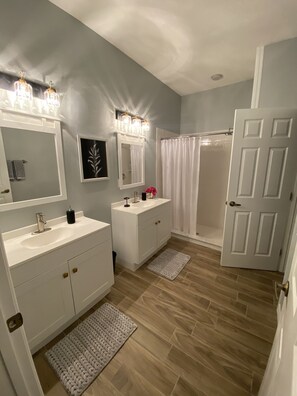 Shower, hair dryer, towels, soap