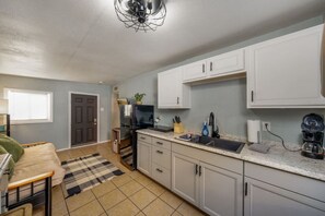 Fridge, microwave, stovetop, coffee/tea maker