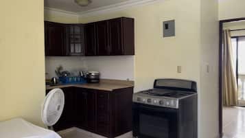 Apartment | Private kitchen | Full-sized fridge, oven, cookware/dishes/utensils