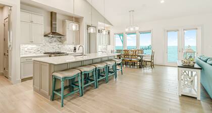 Bayfront water-view home with outdoor pool, lovely patio, hammock, fishing dock
