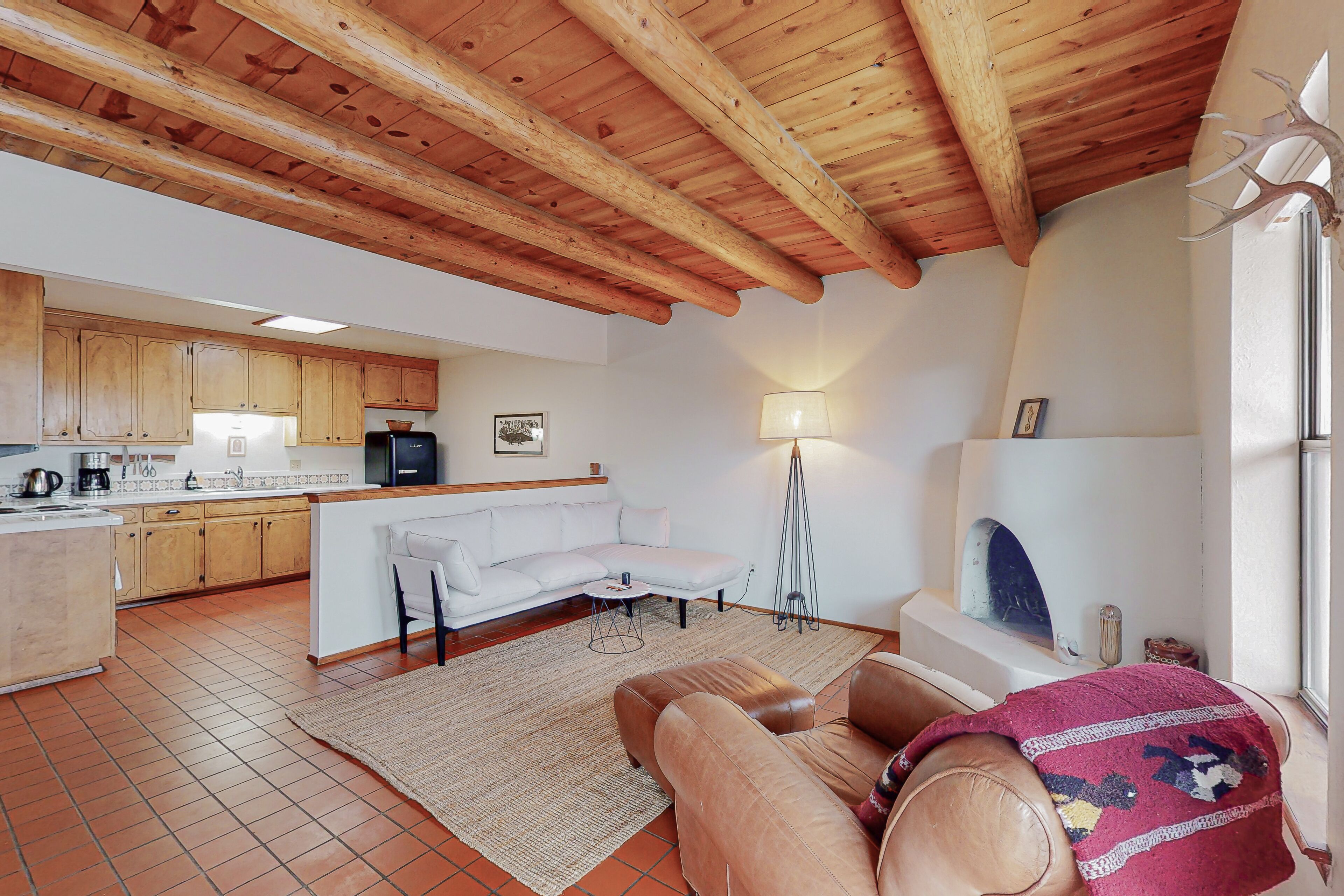 Charming home with enclosed yard, patio, kiva fireplace, & Southwest style