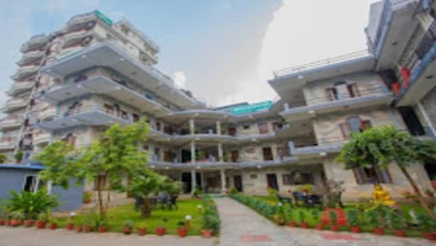 A multi-story hotel with balconies and a central courtyard. - Merostay 019 Hotel Bien Venue (Pokhara)