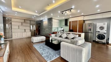 Deluxe Apartment | Living area | 43-inch LCD TV with cable channels, TV
