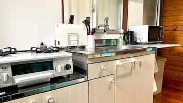 Villa | Private kitchen | Microwave, stovetop, electric kettle, toaster