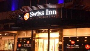The exterior of a Swiss Inn hotel with a prominent sign and entrance. - Swiss Inn Hotel Mersin (Mersin)