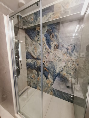 Shower, hair dryer, towels, soap