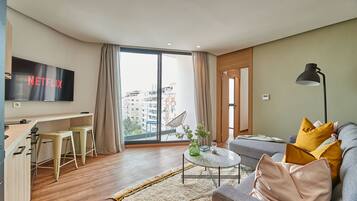 Comfort Apartment | Living area | 43-inch Smart TV with satellite channels, TV, offices