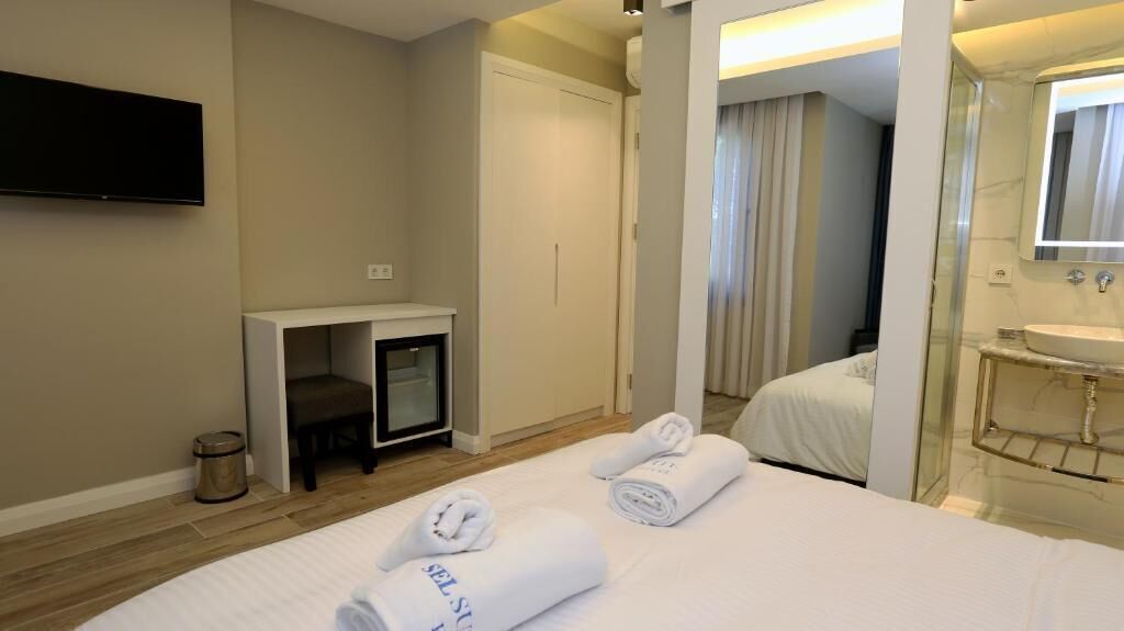 Luxe beddengoed, een minibar, een kluis op de kamer, een bureau