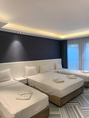 Standard Quadruple Room | Premium bedding, minibar, in-room safe, desk - Sel Suite Hotel (Istanbul)