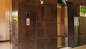 An elevator with a digital display indicating the floor number and direction.