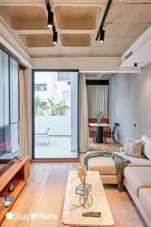 Superior Apartment | Living area | 46-inch Smart TV with satellite channels, TV