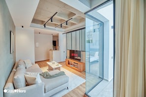 Superior Apartment | Living area | 46-inch Smart TV with satellite channels, TV