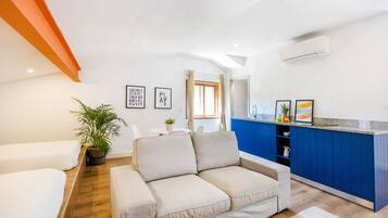 Premium Studio | Living area | 32-inch LCD TV with cable channels, TV