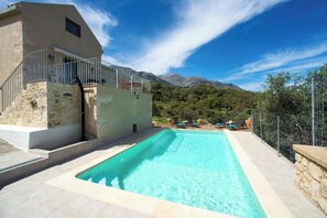 Seasonal outdoor pool, pool loungers