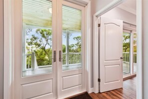A white door with a glass panel and a white door with a glass panel.