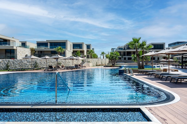 Indoor pool, 2 outdoor pools, open 9:00 AM to 9:00 PM, pool umbrellas