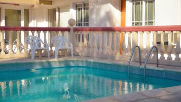 Indoor pool, outdoor pool, open 10:00 AM to 11:00 AM, pool umbrellas