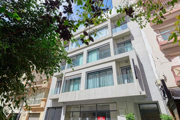 Residential building with large windows and a clean, minimalist design.