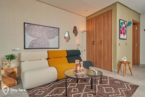 Relax in this stylish living room with a sofa, coffee table, and floor lamp.