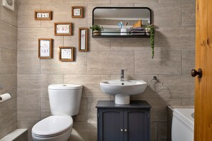 Bathtub, hair dryer, towels