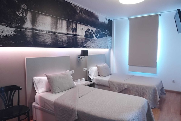 Twin kamer | Luxe beddengoed, individueel gedecoreerd, verduisterende gordijnen