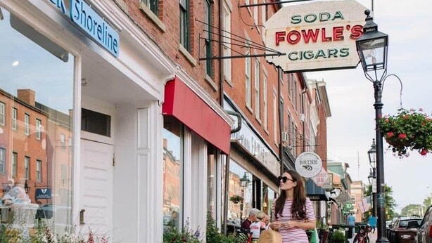A street with storefronts, including 'Soda Fowle's Cigars' and 'Soak Shoreline'.