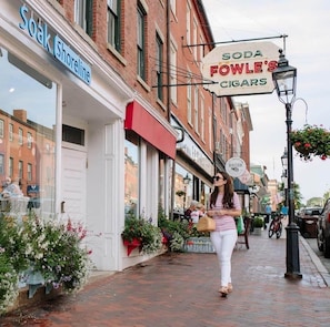 A street with storefronts, including 'Soda Fowle's Cigars' and 'Soak Shoreline'.