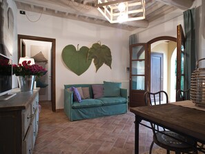 Family Condo | Living area | 32-inch flat-screen TV with satellite channels, TV - San Ruffino Apartments (Casciana Terme Lari)