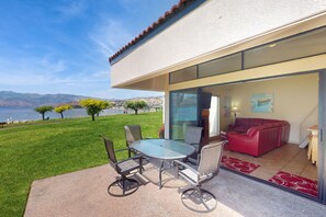 Outdoor dining - Lakefront loft studio with covered deck, views, pool, hot tub, & tennis courts (Chelan)
