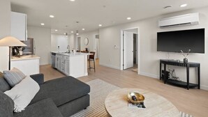 A modern apartment with a living room, kitchen, and dining area. - King Bed! J & K on Main Luxury Apartment 302 (Spokane)