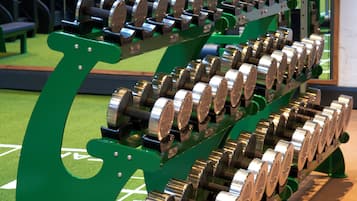 A weightlifting machine with multiple adjustable weights.