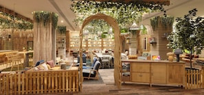 A cozy, plant-filled lounge area with wooden furniture and a bar. - Treehouse Hotel Manchester (Manchester)