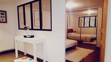 1 bedroom, desk, iron/ironing board, travel crib