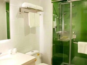 A bathroom with a glass-enclosed shower, a white sink, and a toilet. - Green Tree Inn Yantai Zhifu Donglu Branch (Yantai)