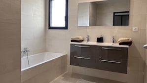 Shower, hair dryer, towels, soap