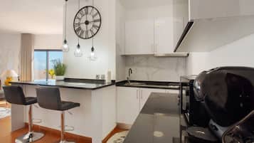 Fridge, microwave, stovetop, coffee/tea maker