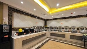 A buffet area with multiple self-service stations, a coffee machine, and a small refrigerator. - Vienna Hotel (Huidong Jilong) (Huidong)